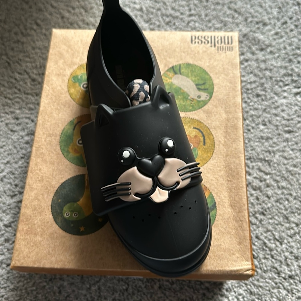 Brand new. Never worn Melissa sneakers